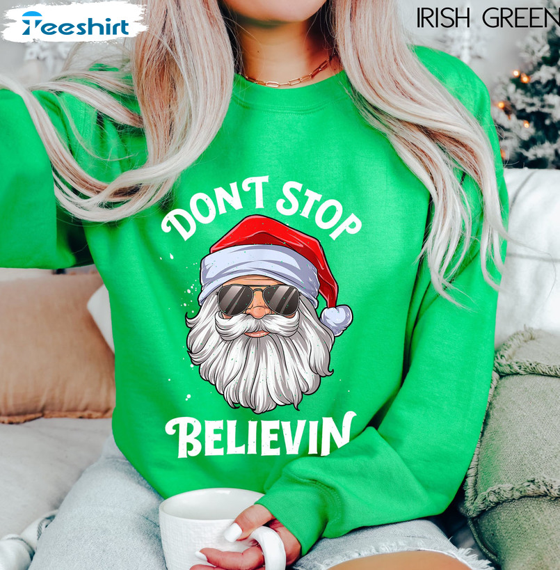 Don’t Stop Believin Christmas Shirt, Cute Santa Claus Crewneck Unisex Hoodie