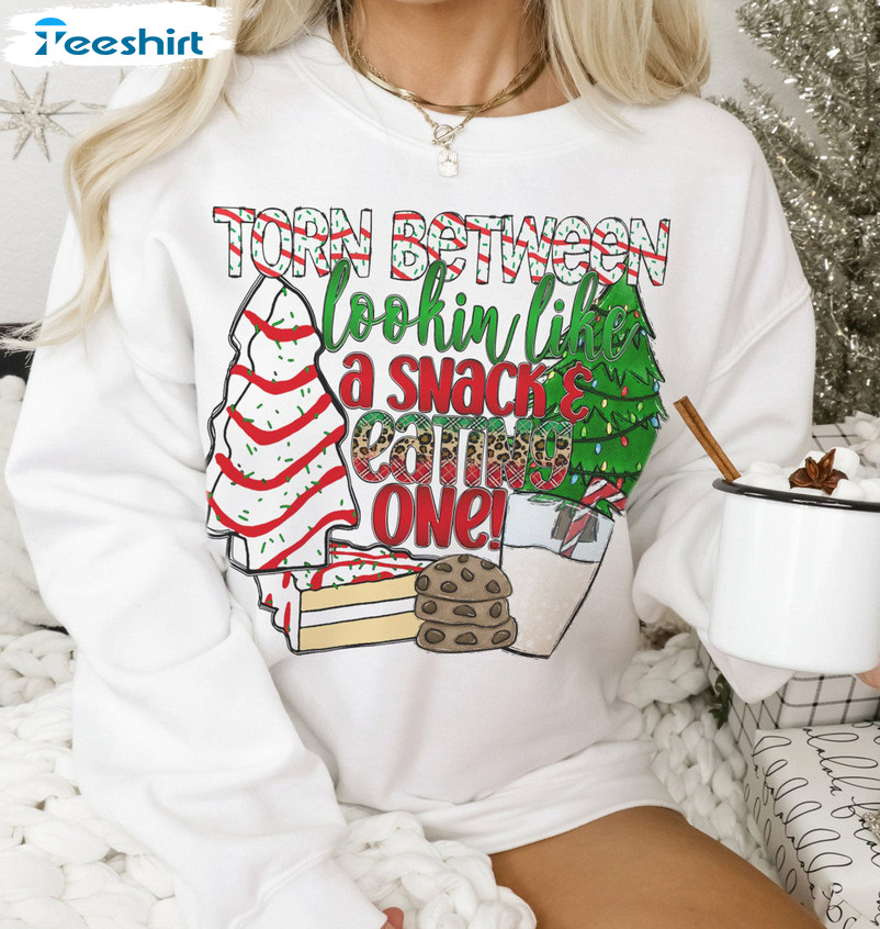 Torn Between Lookin’ Like A Snack And Eatin’ One Shirt – Christmas Sweatshirt Long Sleeve